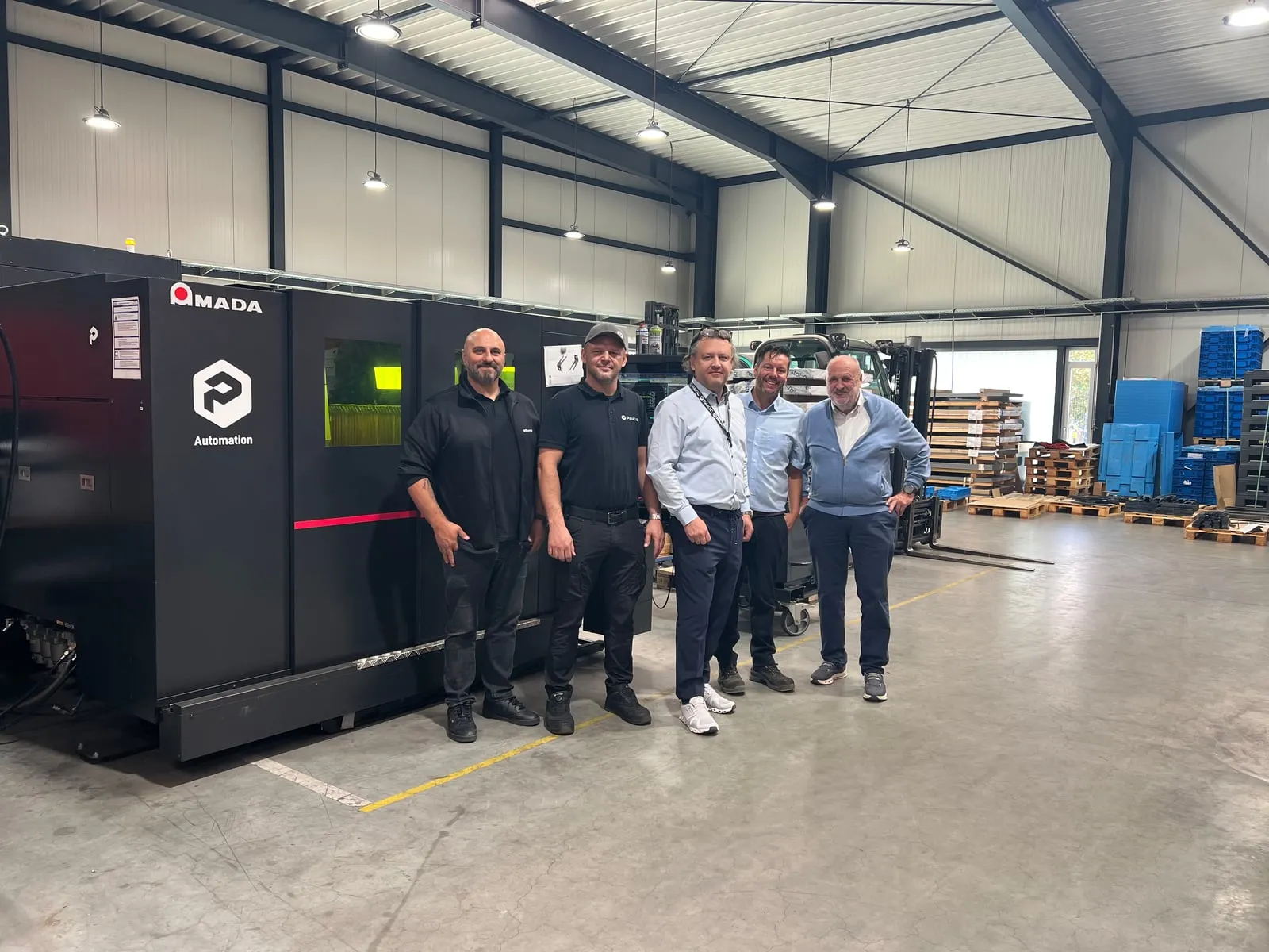 The PAKIC team at their laser cutting machine